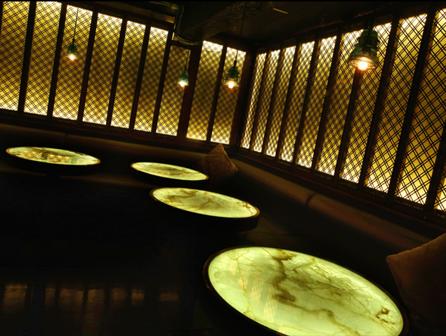 Bespoke onyx tables inside House of Coco Tang