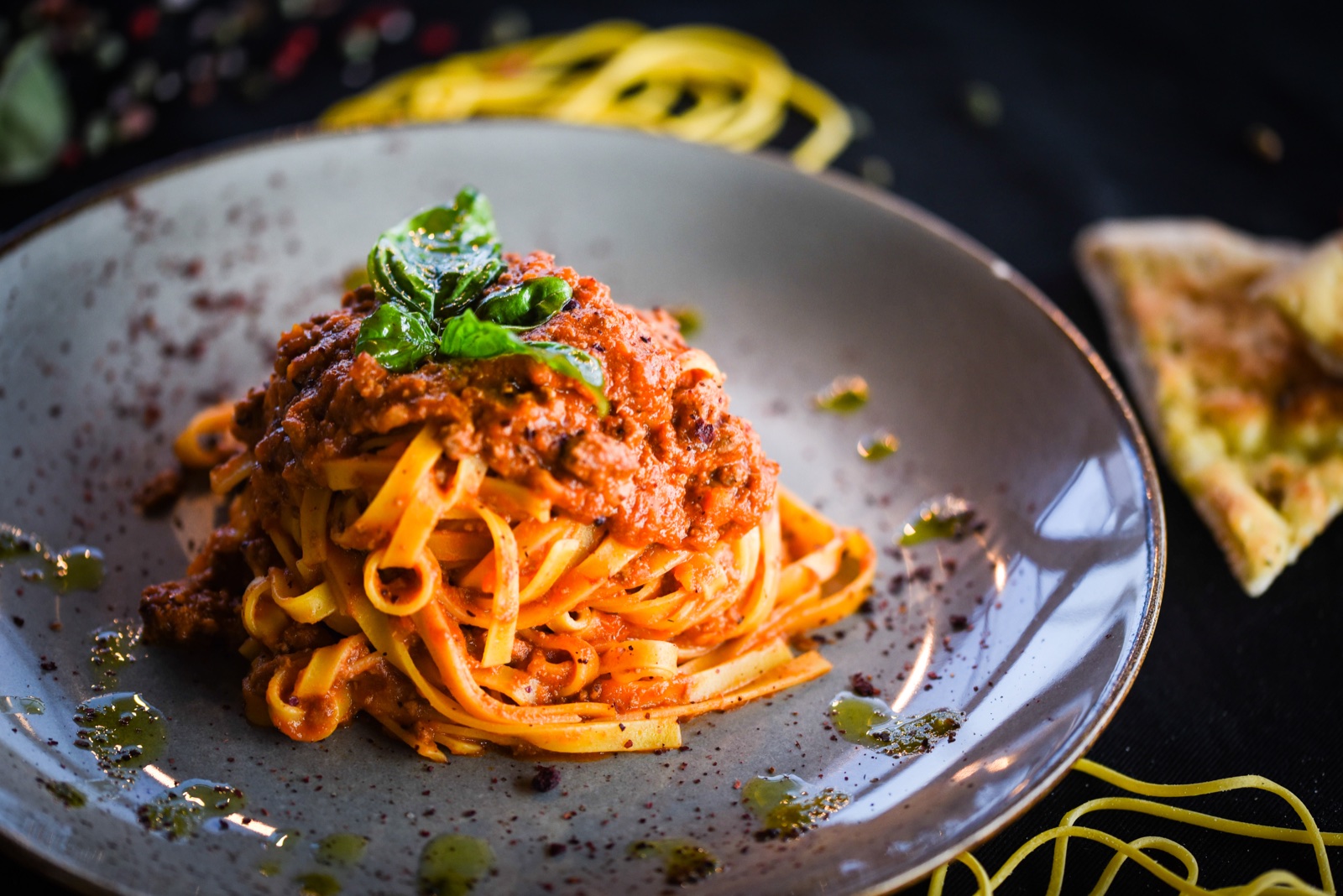 Tagliatelle with rich tomato ragù and fresh basil